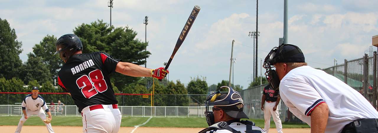 Men's baseball game view behind home plate