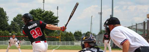 Men's baseball game view behind home plate