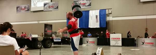 Large man lifting huge weight